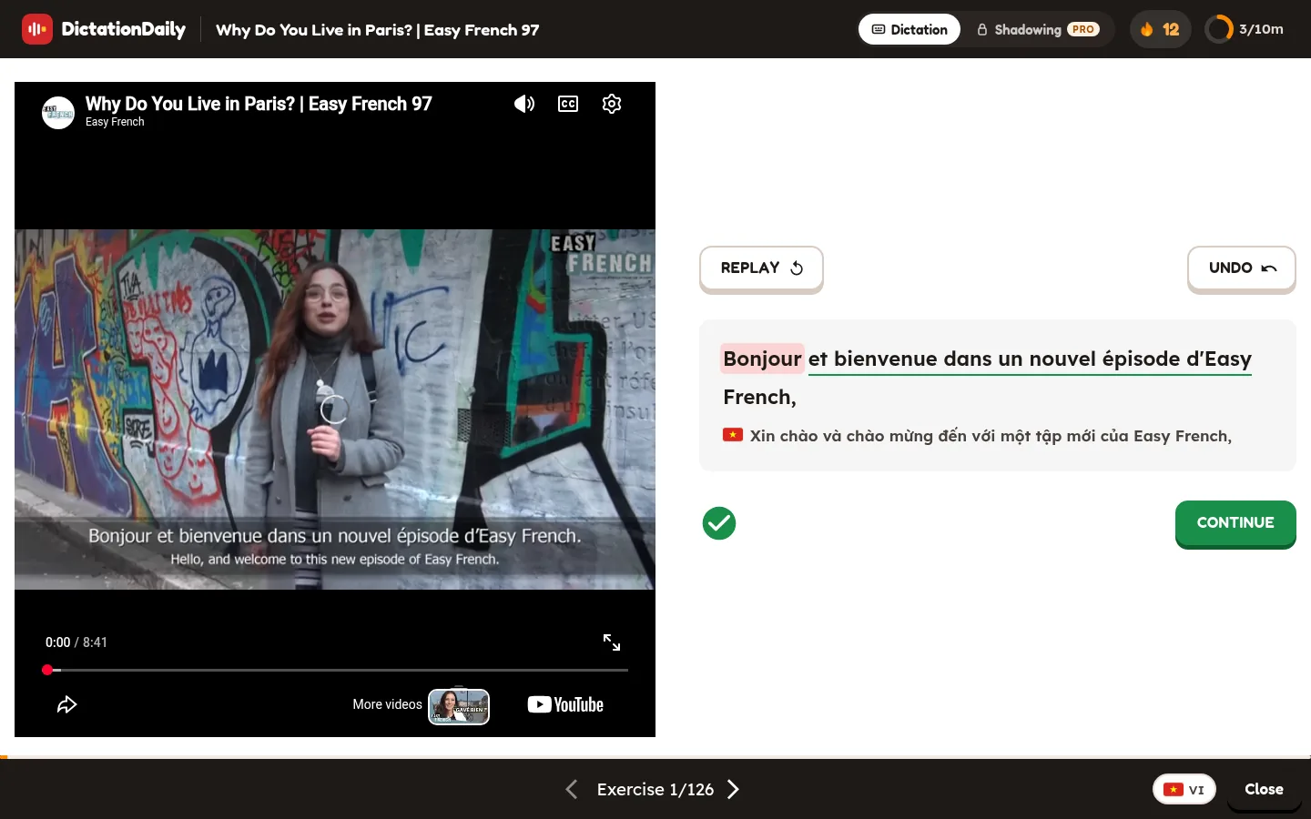 A French lesson: the sentence is right and under it a Vietnamese flag and the translation